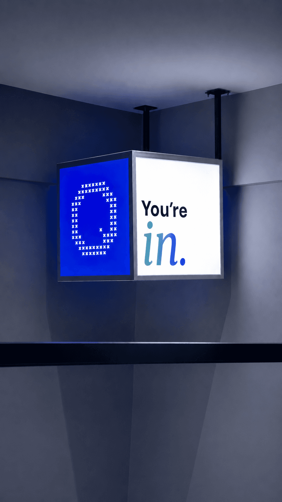 QLAB lightbox signage reading You're in.